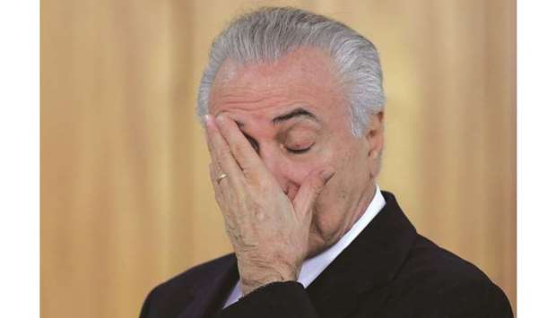 President Michel Temer reacts during a credentials presentation ceremony for several new top diplomats at Planalto Palace in Brasilia.