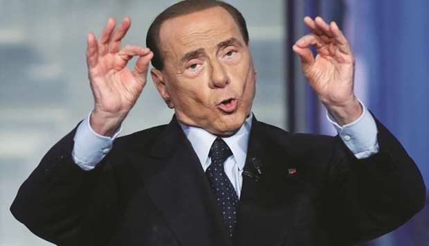 Silvio Berlusconi gestures during a television talk show in Rome.