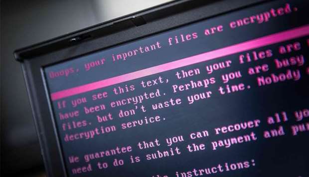 A laptop displays a message after being infected by a ransomware
