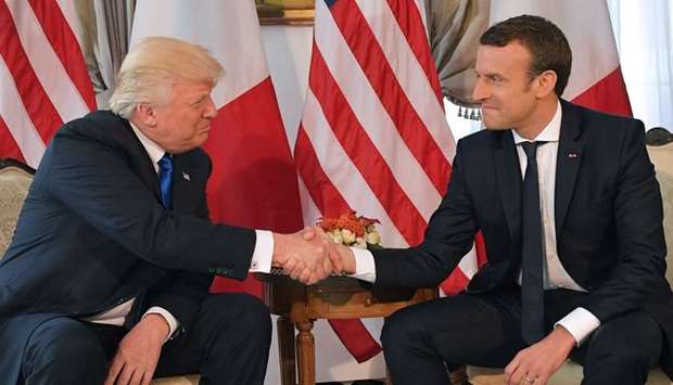 US President Donald Trump (L) and French President Emmanuel Macron