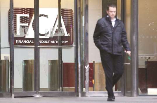 A visitor exits the offices of the Financial Conduct Authority in London. Britainu2019s markets watchdog announced radical changes to the countryu2019s u00a37tn asset management industry yesterday, seeking to improve transparency and value for money for customers.
