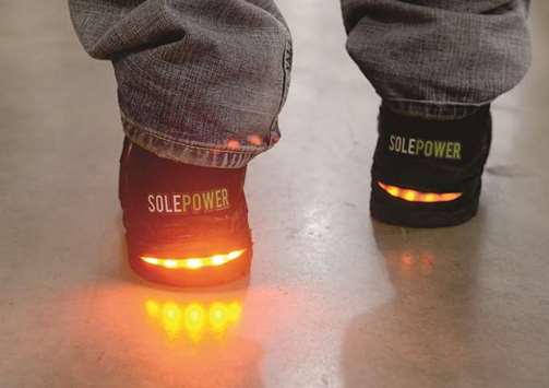 GOOD NEWS: Sole Power shoes harnesses the kinetic energy from walking to charge batteries and power electronic devices, including lights on industrial boots, at the Tech Shop in East Liberty, Pittsburgh. Sole Power is developing a self-charging industrial workboot that helps workers be safer and more productive.