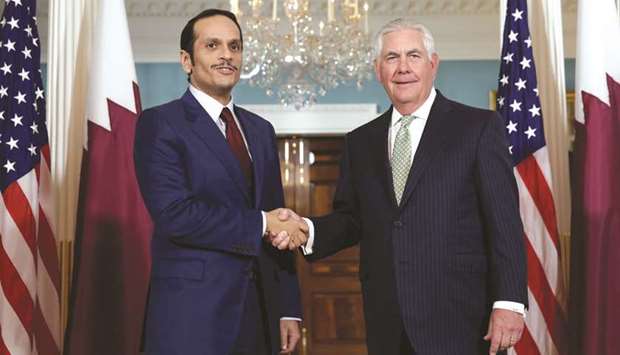 Qatari Foreign Minister HE Sheikh Mohamed bin Abdulrahman al-Thani shakes hands with US Secretary of State Rex Tillerson before their meeting at the State Department in Washington, yesterday.