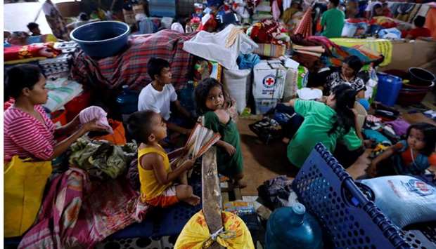 Evacuated residents rest at an evacuation centre in Iligan, while government forces fight insurgents from the Maute group in Marawi, Philippines