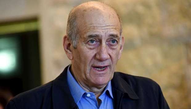 Former Israeli Prime Minister Ehud Olmert speaks to the media after a hearing at the Supreme Court in Jerusalem December 29, 2015