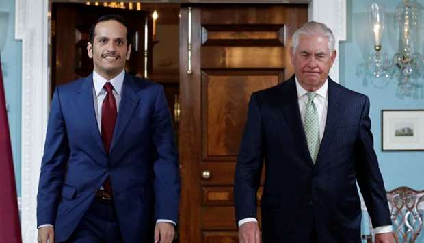Foreign Minister HE Sheikh Mohammed bin Abdulrahman Al-Thani (L) walks with US Secretary of State Rex Tillerson before their meeting at the State Department in Washington, US, June 27.
