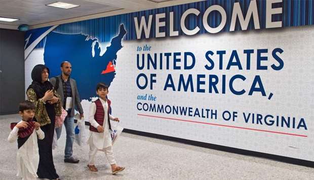 International travelers leave the Customs and Immigration area of Dulles International Airport (IAD)