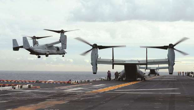 US Marine MV-22B Osprey aircraft land on the deck of the USS Bonhomme Richard amphibious assault ship during events marking the start of Talisman Saber 2017, a biennial joint military exercise between the United States and Australia, off the coast of Sydney.
