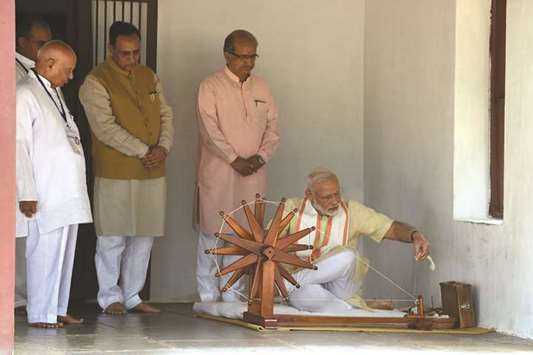 Prime Minister Narendra Modi spins a yarn on a charkha (spinning wheel) during his visit to Mahatma Gandhiu2019s Sabarmati Ashram in Ahmedabad yesterday.