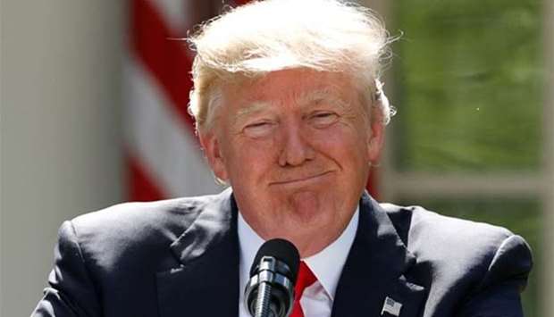 US President Donald Trump pauses as he announces that the United States will withdraw from the landmark Paris Climate Agreement, in the Rose Garden of the White House in Washington on Thursday.