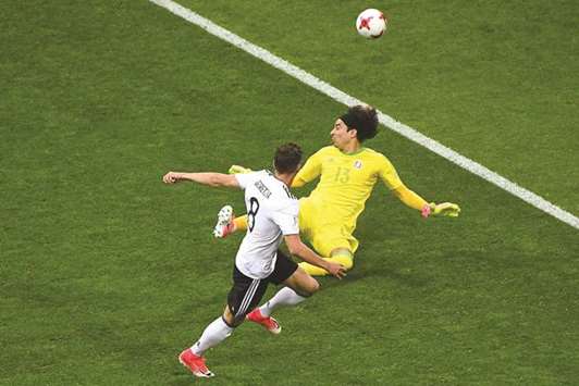 Germanyu2019s midfielder Leon Goretzka (L) scores his teamu2019s first goal past Mexicou2019s goalkeeper Guillermo Ochoa during their Confederations Cup semi-final at the Fisht Stadium in Sochi yesterday.