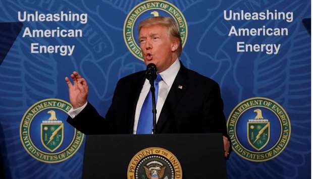 US President Donald Trump delivers remarks during an 'Unleashing American Energy' event at the Department of Energy, yesterday in Washington.