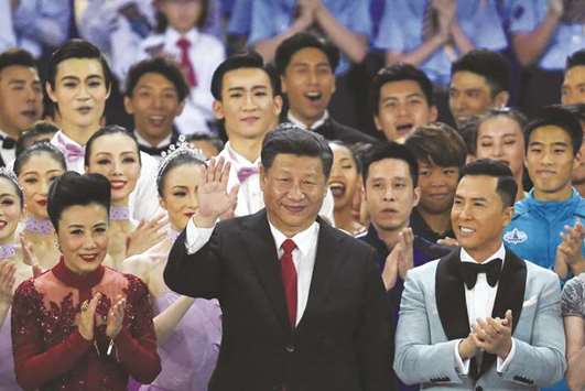 Chinau2019s President Xi Jinping waves at the end of a variety show in Hong Kong.