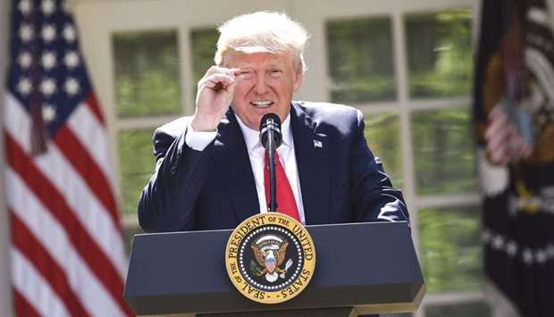 US President Donald Trump announces his decision to withdraw the US from the Paris Climate Accords in the Rose Garden of the White House in Washington, DC, on Thursday.