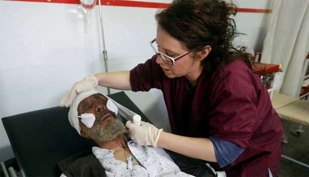 An injured man receives treatment at a hospital after a blast in Kabul