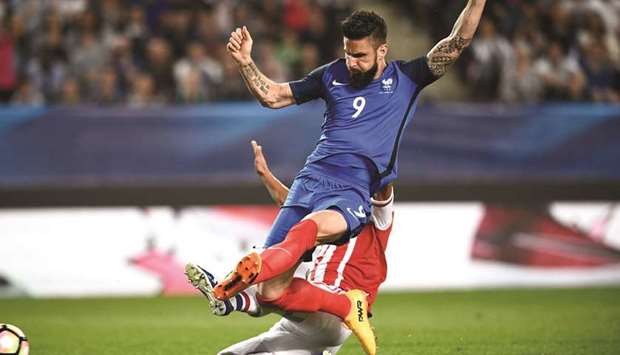 Franceu2019s Olivier Giroud (foreground) scores a goal during a friendly against Paraguay in Rennes, France, on Friday. (AFP)