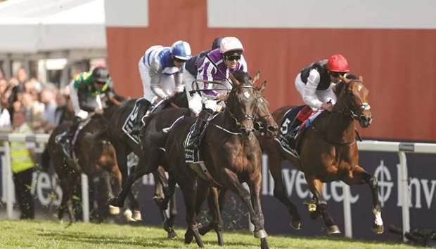 Padraig Beggy on Wings Of Eagles (foreground) wins the Epsom Derby yesterday. (Reuters)