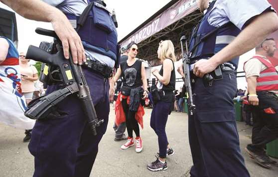 Heavily-armed police officers guard the main entrance to the open-air weekend u2018Rock am Ringu2019 concert at Germanyu2019s Formula One race track Nuerburgring.