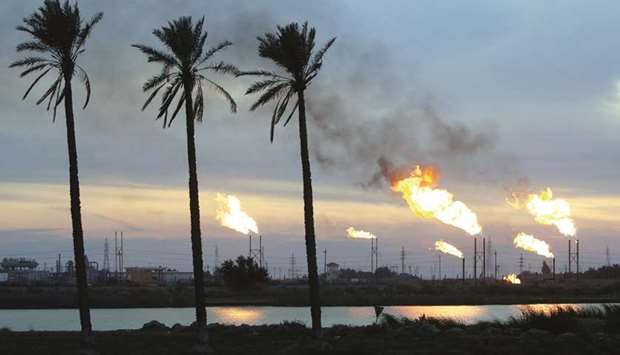 Flames emerge from flare stacks at the oil fields in Basra. Tankers loaded 122mn barrels of Iraqi crude at ports in the Gulf and Mediterranean Sea last month, according to vessel-tracking and shipping agent data gathered by Bloomberg.