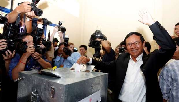 President of the opposition Cambodia National Rescue Party (CNRP) Kem Sokha casts his vote
