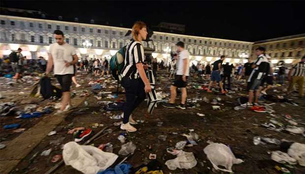 Juventus supporters look for personal belongings at Piazza San Carlo after the panic movement