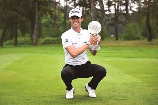 Renato Paratore poses with the trophy after winning Nordea Masters yesterday. (Reuters)