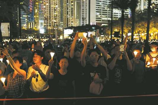 Thousands of people take part in a candlelight vigil to mark the 28th anniversary of the crackdown of the pro-democracy movement at Beijingu2019s Tiananmen Square in 1989, at Victoria Park in Hong Kong.