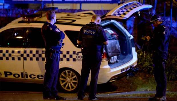 Police are pictured in the Melbourne bayside suburb of Brighton