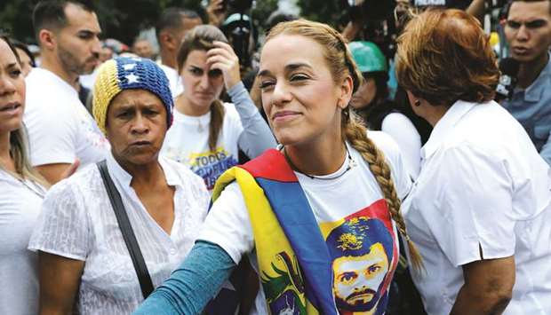 Lilian Tintori, wife of jailed opposition leader Leopoldo Lopez, takes part in a rally against President Maduro in Caracas yesterday.
