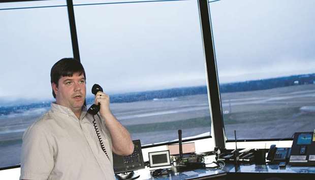 An air traffic controller specialist works at the Frederick Municipal Airport control tower in Frederick, Maryland. Trump yesterday used blunt language to attack his own Federal Aviation Administration, saying it wasted billions of dollars in technology and accusing it u2014 without offering proof u2014 of using equipment that dated back decades.
