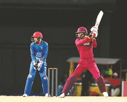 West Indies' Marlon Samuels (right) plays a shot during the third and final T20 match against Afghanistan at the Warner Park in Basseterre, St. Kitts, on Monday. (AFP)