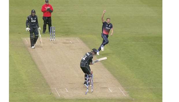 Englandu2019s Jake Ball (right) celebrates after dismissing New Zealand opener Luke Ronchi during the ICC Champions Trophy match in Cardiff. (Reuters)