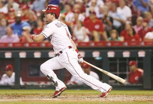 Cincinnati Reds right fielder Scooter Gennett hits a two-run double against the St. Louis Cardinals at Great American Ball Park. PICTURE: USA TODAY Sports
