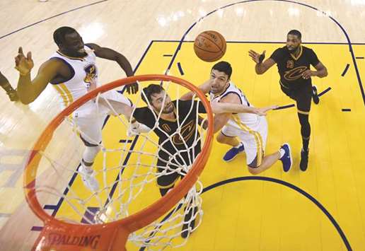 Cleveland Cavaliers centre Tristan Thompson (Right) tries to get the ball to forward Kevin Love (No 0) between Golden State Warriors forward Draymond Green (left) and centre Zaza Pachulia during the game two of the 2017 NBA Finals at Oracle Arena. PICTURE: USA TODAY Sports