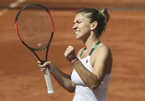 Romaniau2019s Simona Halep celebrates after defeating Ukraineu2019s Elina Svitolina in their French Open quarter-final in Paris yesterday. (Reuters)