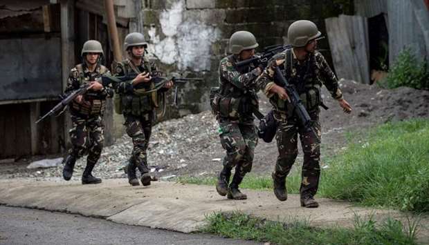 Philippine Army Scout Rangers move positions during a mission  in Marawi
