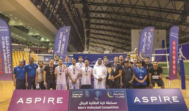 Aspire Zone Foundation Events manager Abdullah Aman al-Khater with the winners of the menu2019s volleyball tournament in Ramadan Sports Festival at Aspire Zone.