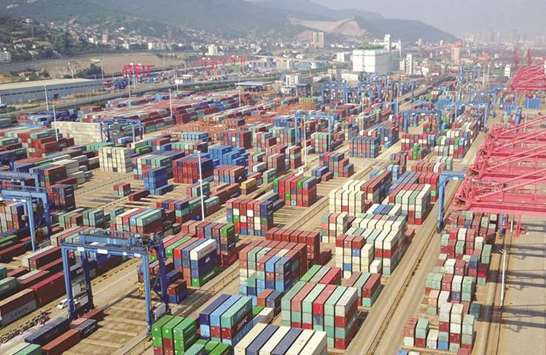 Containers are seen at the port in Lianyungang, Jiangsu province. China yesterday posted a forecast-busting surge in exports and imports in May, signalling improvement in the worldu2019s number two economy, but there were warnings Beijing would struggle to maintain its momentum.