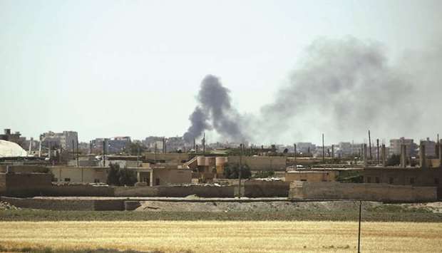 Smoke rises from buildings in the al-Meshleb neighbourhood of Raqa as the Syrian Democratic Forces (SDF), made up of an alliance of Kurdish and Arab fighters, try to advance further into the Islamic State groupu2019s Syrian bastion.