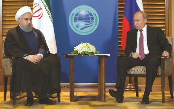 Russian President Vladimir Putin meets with Iranian President Hassan Rouhani on the sidelines of the  Shanghai Co-operation Organisation (SCO) Summit in Qingdao, yesterday.