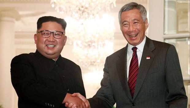 North Korea's leader Kim Jong Un shakes hands with Singapore's Prime Minister Lee Hsien Loong at the Istana in Singapore