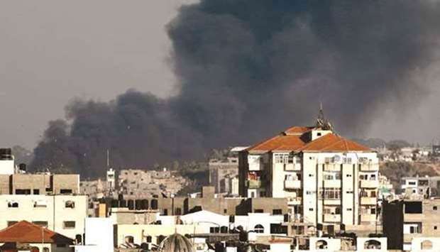 Smoke billows following an Israeli air strike on Gaza Strip last month.