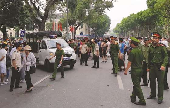 Police disperse a demonstration against a draft law on the Special Economic Zone in Hanoi yesterday.