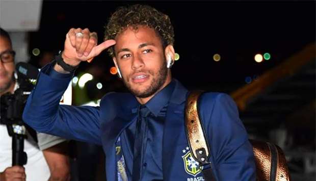 Brazil's forward Neymar gestures upon the team's arrival at Sochi airport in Russia on Monday, ahead of the FIFA World Cup.