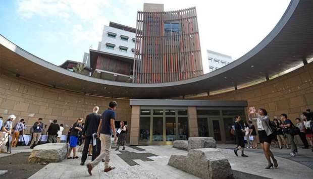 Journalists tour the new office complex of the American Institute in Taiwan (AIT) during a dedication ceremony in Taipei