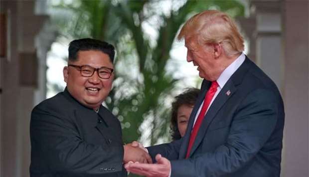 President Donald Trump and North Korean leader Kim Jong Un shake hands at the Capella Hotel on Sentosa island in Singapore on Tuesday.