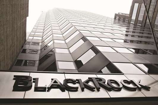 A BlackRock logo hangs above the entrance to its headquarters building in New York. The worldu2019s largest asset manager is marketing its risk analytics software, known as Aladdin, to the army of wealth managers who oversee billions of dollars in client assets.