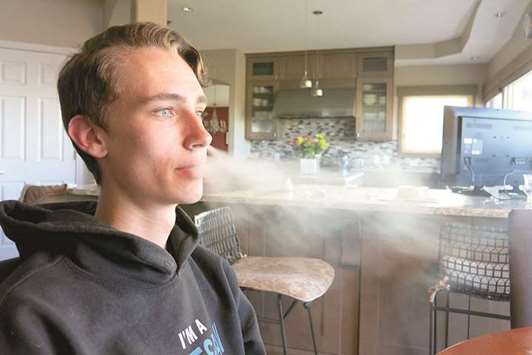 HOOKED: Julien Lavandier, a Colorado State University student, started smoking e-cigarettes as a high school sophomore. He says heu2019s now hooked on Juul and has been unable to quit.