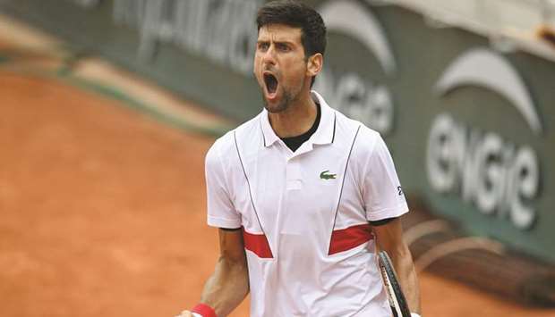 Serbiau2019s Novak Djokovic reacts during his menu2019s singles third round match against Spainu2019s Roberto Bautista Agut, on day six of the French Open in Paris yesterday.