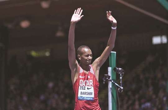 Mutaz Essa Barshim of Qatar waves to the crowd after winning the high jump event during the Eugene Diamond League. (AFP)